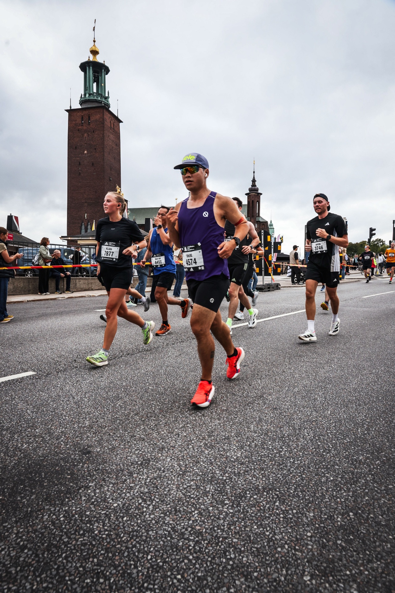 Xinjie Chen racing past Stockholm City Hall